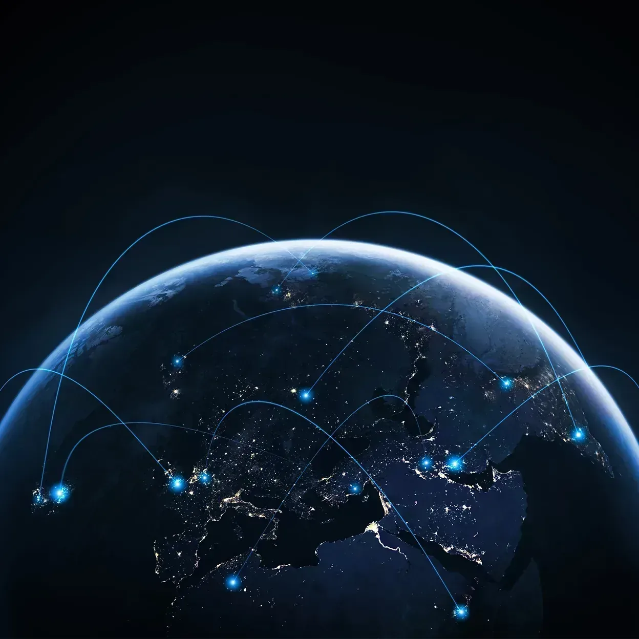 Globe at night with illuminated cities and blue arcs connecting various locations