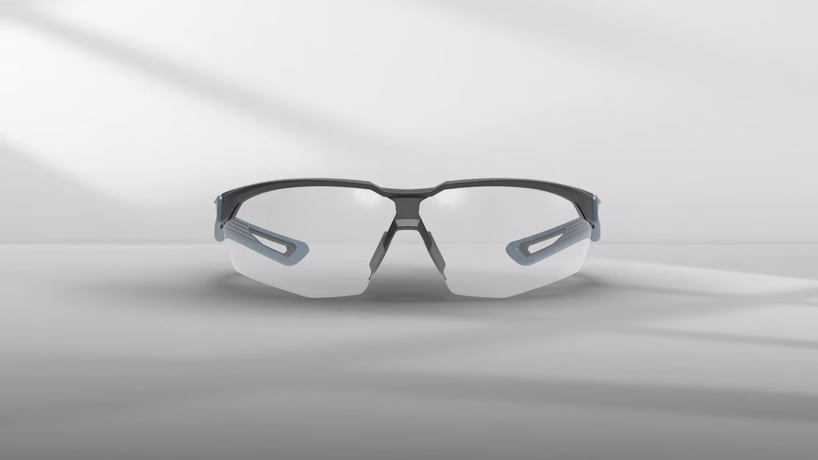 Sporty eyewear with a sleek design, featuring clear lenses and gray accents.