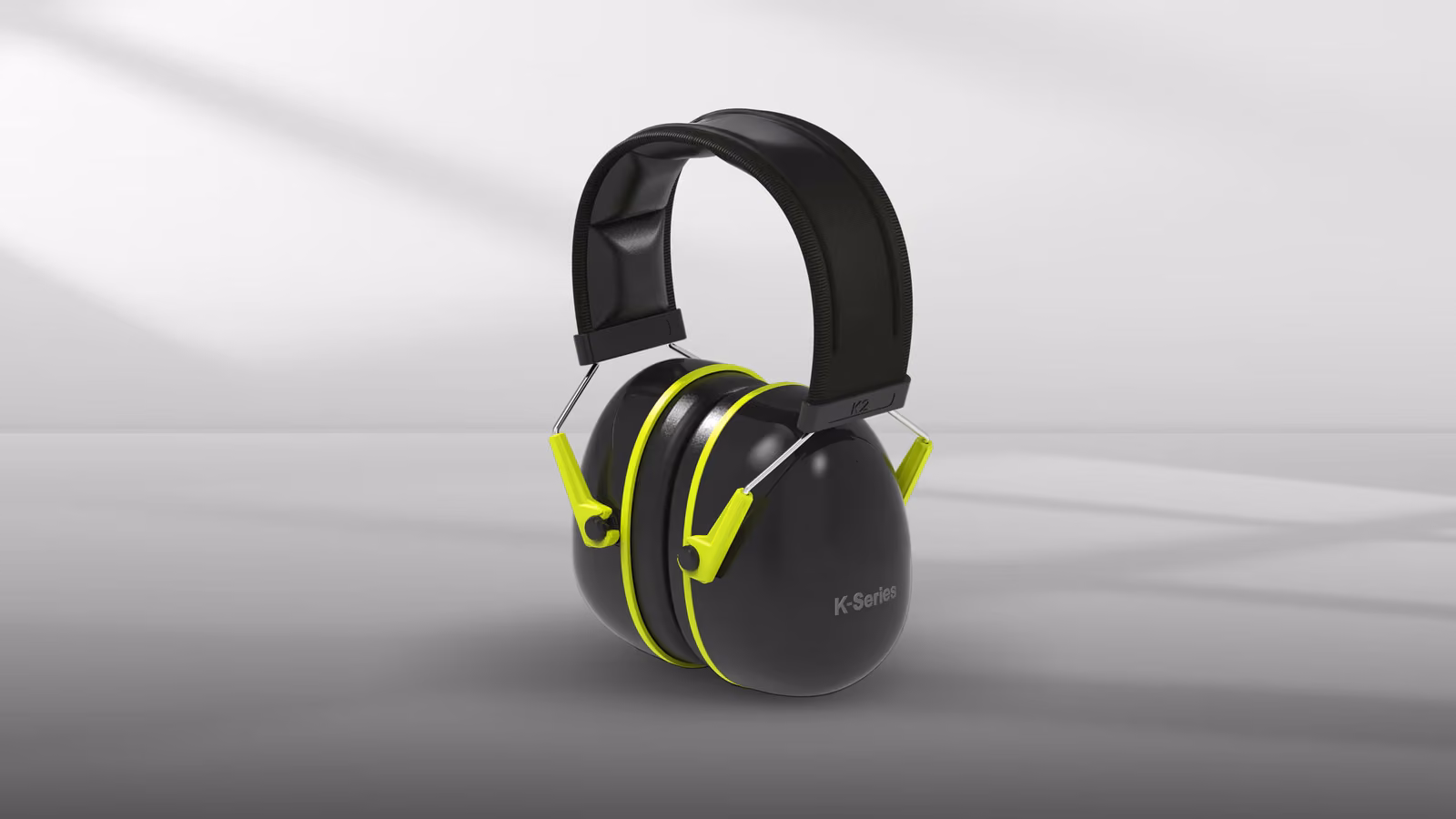 Black headphones with lime green accents, featuring a padded headband and ear cups.