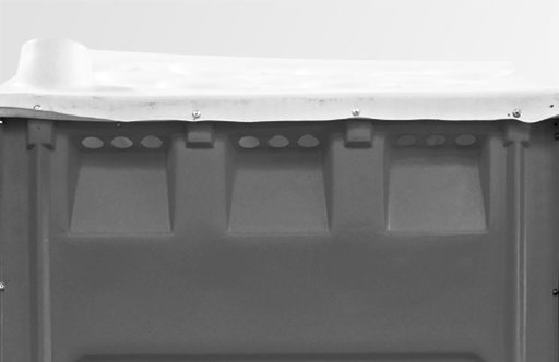 A gray container with a smooth white lid and ventilation holes near the top.