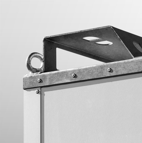 Close-up of a metallic structure with a looped handle and a triangular support bracket.